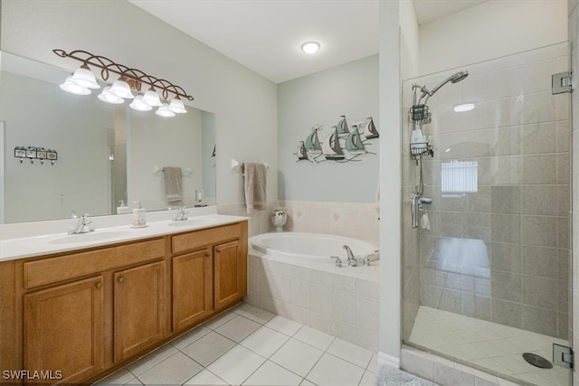 bathroom featuring tile patterned floors, vanity, and shower with separate bathtub