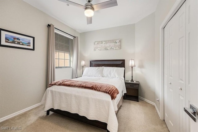 carpeted bedroom with a closet and ceiling fan