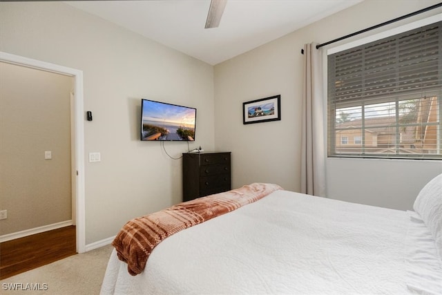 bedroom with wood-type flooring and ceiling fan