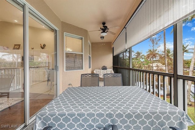 sunroom / solarium with ceiling fan