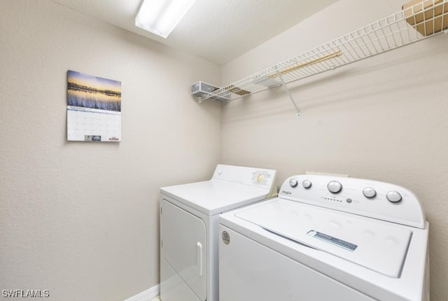 4625 Saint Croix Ln Unit 1132, Naples, FL 34109 - washroom with washing machine and clothes dryer and baseboards