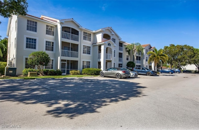 4625 Saint Croix Ln Unit 1132, Naples, FL 34109 - view of building exterior featuring uncovered parking