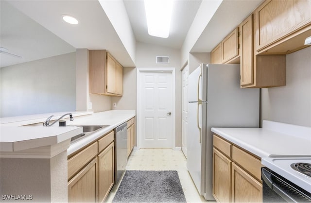4625 Saint Croix Ln Unit 1132, Naples, FL 34109 - kitchen featuring light floors, stainless steel dishwasher, light brown cabinetry, light countertops, and a peninsula