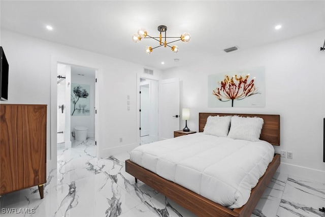 bedroom with a chandelier and ensuite bath