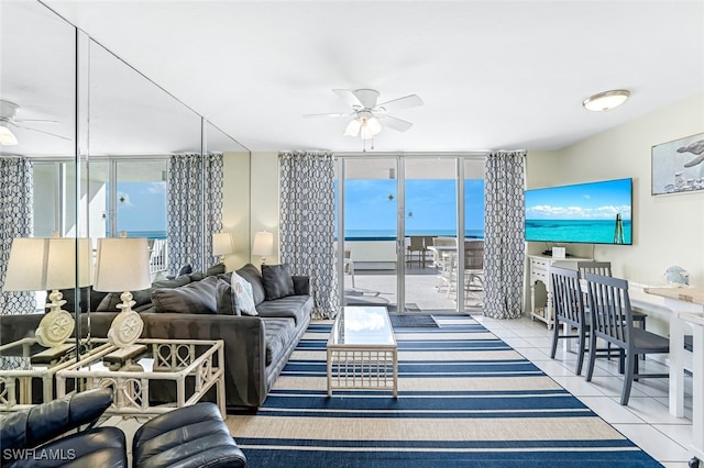 living room featuring ceiling fan and light tile patterned flooring