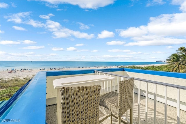 exterior space featuring a beach view and a water view