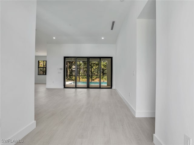 unfurnished room with light hardwood / wood-style flooring