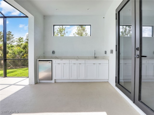 bathroom with plenty of natural light and sink