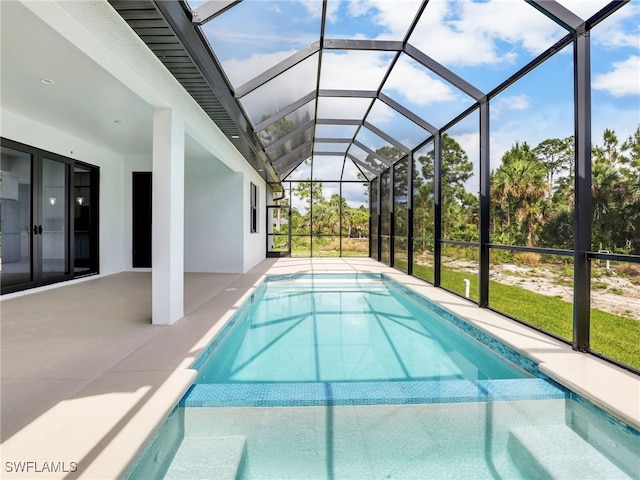 view of pool featuring a lanai and a patio area