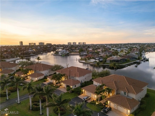 aerial view at dusk with a water view