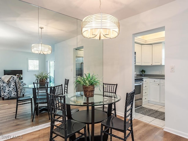 dining area featuring light wood-type flooring