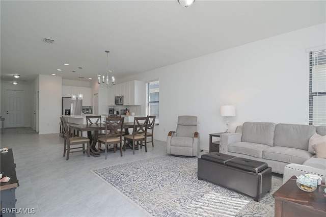 living room featuring an inviting chandelier