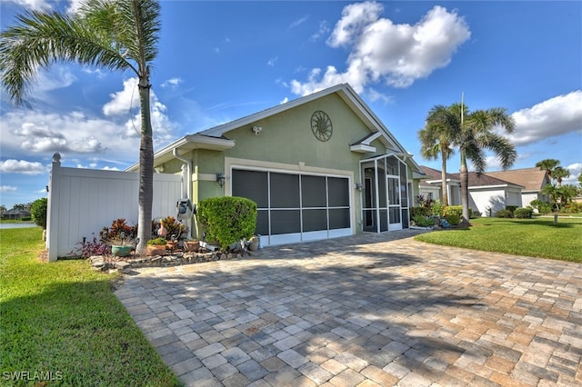 view of front of property with a garage and a front yard