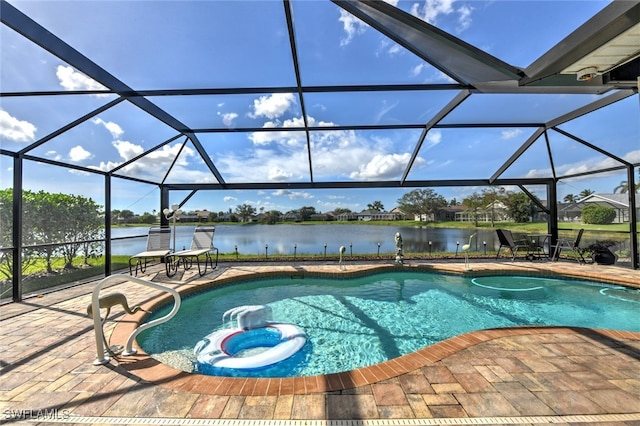 view of pool featuring a hot tub, a patio, a water view, and a lanai