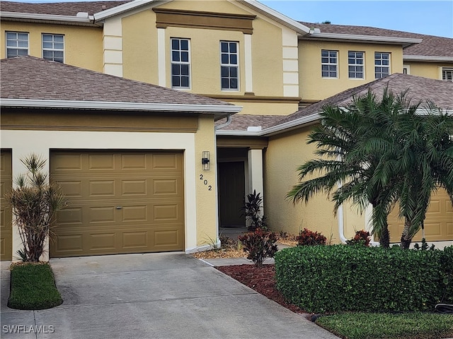 view of front of property with a garage