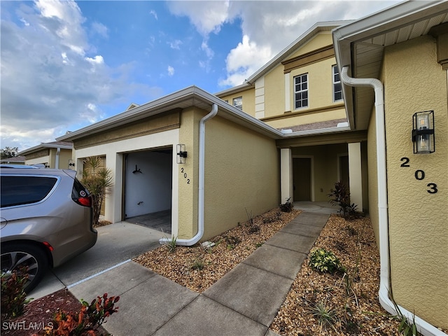 view of exterior entry featuring a garage