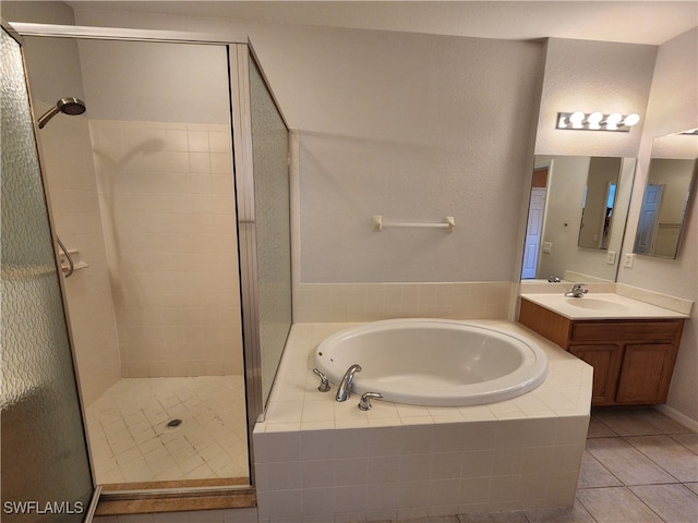 bathroom with vanity, tile patterned floors, and independent shower and bath