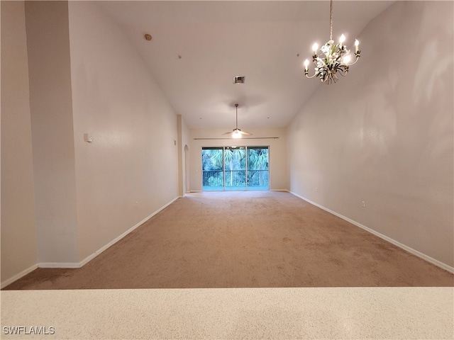 interior space featuring ceiling fan with notable chandelier and vaulted ceiling