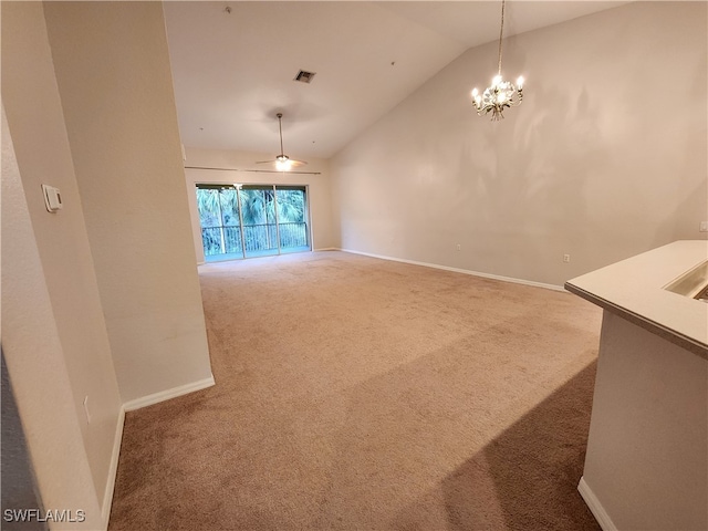 unfurnished dining area with carpet flooring, a chandelier, and vaulted ceiling