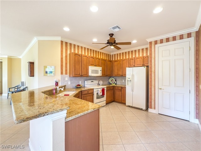 kitchen featuring kitchen peninsula, sink, white appliances, and ornamental molding