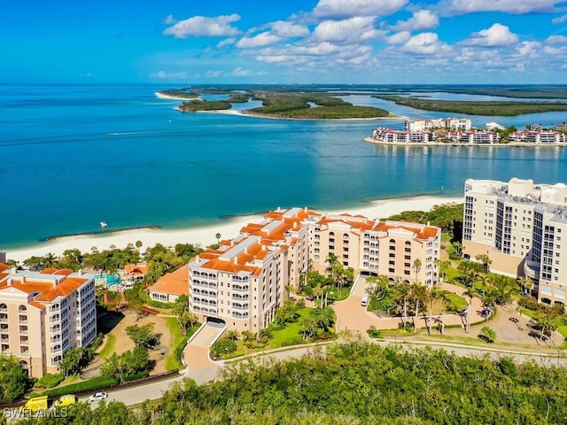 birds eye view of property featuring a view of the beach and a water view