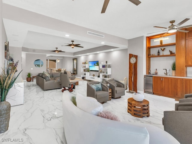 living room with a raised ceiling