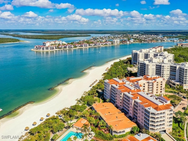 birds eye view of property featuring a view of the beach and a water view