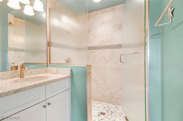 bathroom with vanity and an enclosed shower