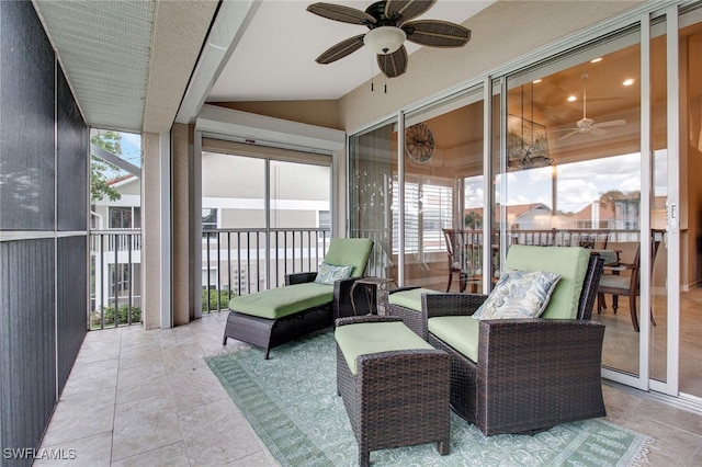 sunroom / solarium featuring vaulted ceiling and ceiling fan