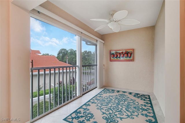 interior space with ceiling fan