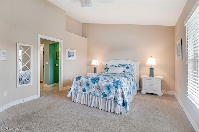 carpeted bedroom featuring ceiling fan and high vaulted ceiling