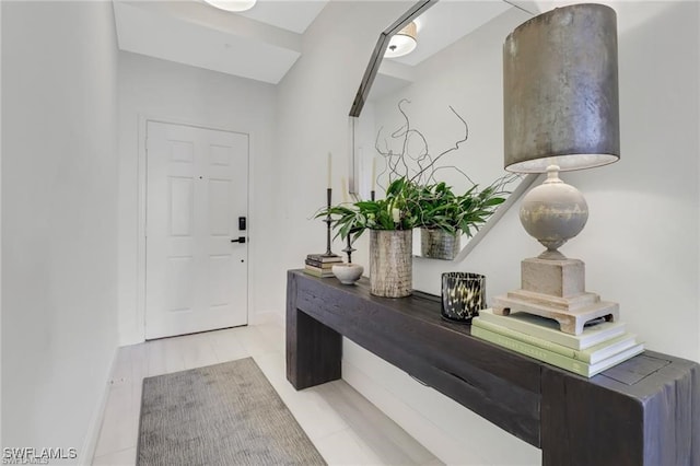 foyer entrance with light tile patterned floors