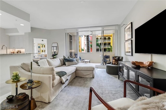 carpeted living room featuring a healthy amount of sunlight