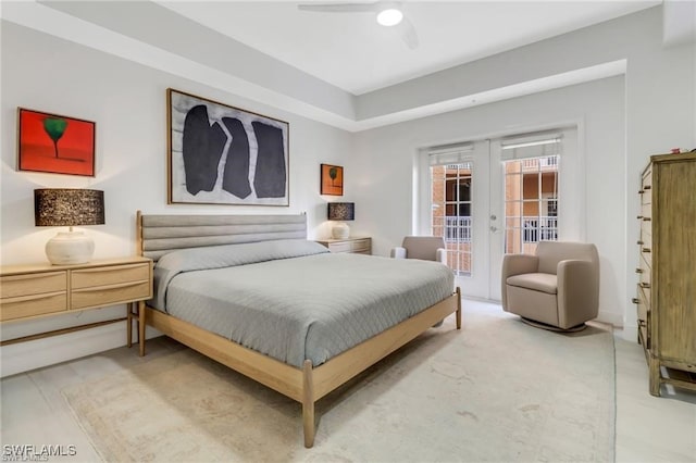 bedroom featuring ceiling fan, french doors, and access to outside