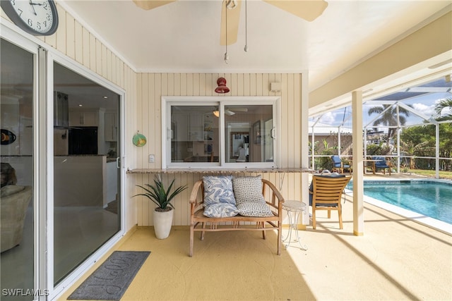 sunroom / solarium with a swimming pool