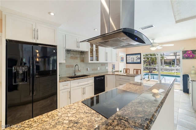 kitchen featuring white cabinets, decorative backsplash, black appliances, sink, and island exhaust hood