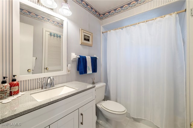 bathroom featuring toilet, curtained shower, vanity, and tile patterned floors