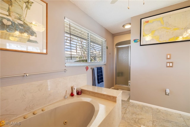 bathroom with independent shower and bath and a textured ceiling