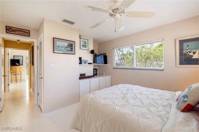 bedroom featuring ceiling fan and a closet