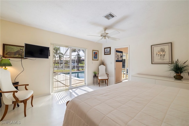 bedroom featuring access to outside, a textured ceiling, and ceiling fan