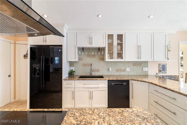 kitchen featuring extractor fan, sink, black appliances, and white cabinetry