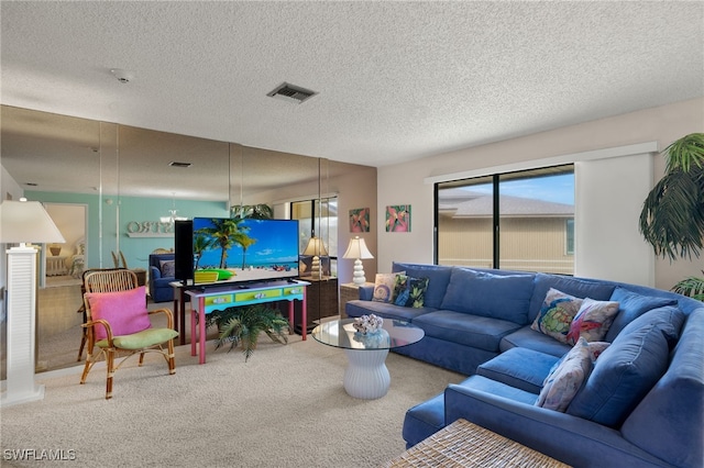 carpeted living room with a textured ceiling