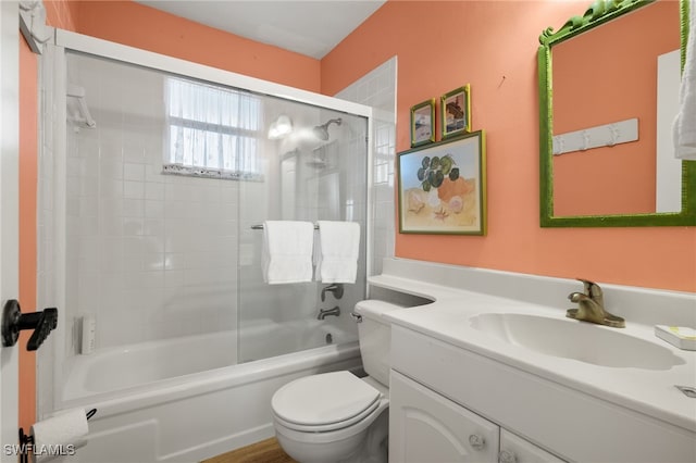 full bathroom featuring vanity, toilet, and tiled shower / bath combo