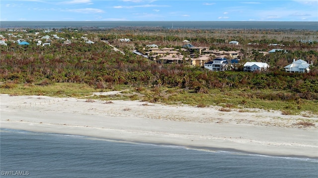 bird's eye view featuring a beach view and a water view