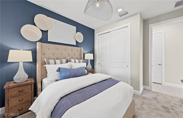 carpeted bedroom with a closet