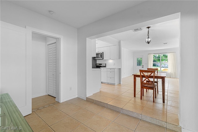 interior space featuring light tile patterned flooring