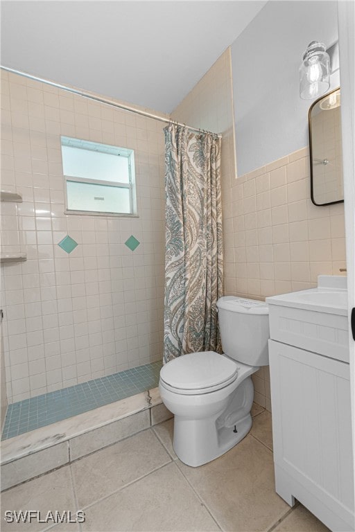 bathroom featuring vanity, walk in shower, tile patterned flooring, and toilet