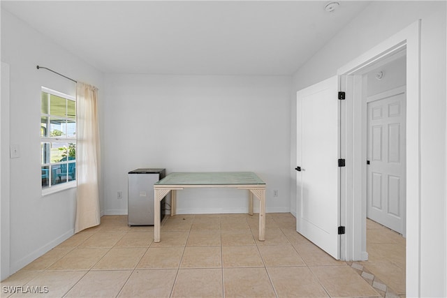 office with light tile patterned flooring