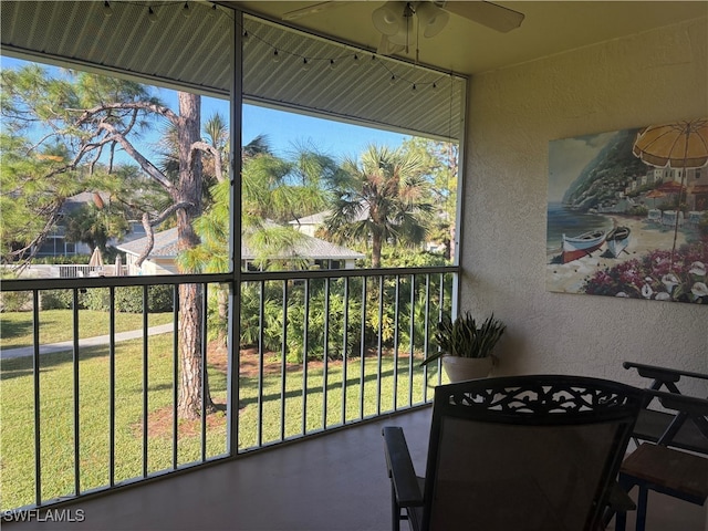 sunroom with ceiling fan and a healthy amount of sunlight