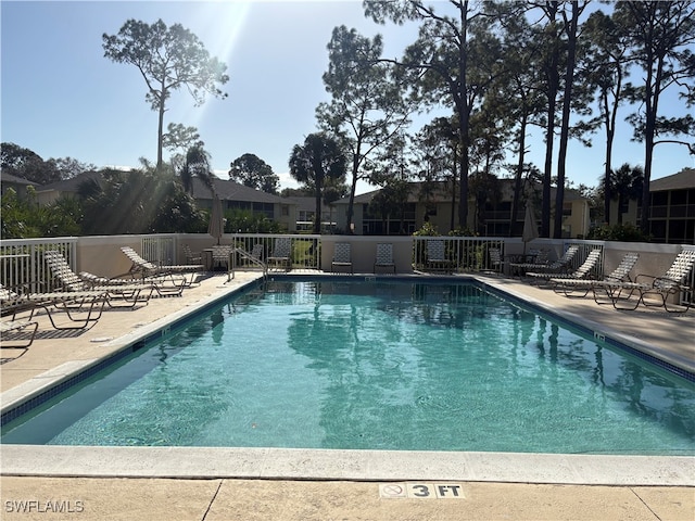 view of swimming pool with a patio